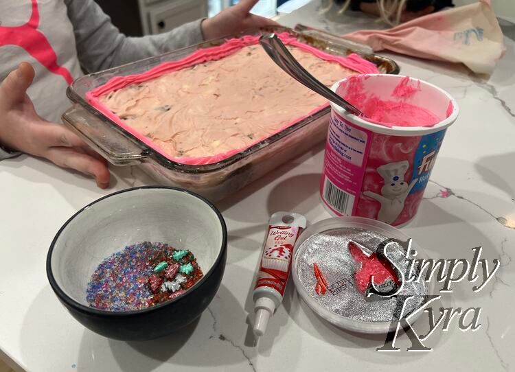 All the toppings spread out and ready to go. Icing, sprinkles, and icing writer. 