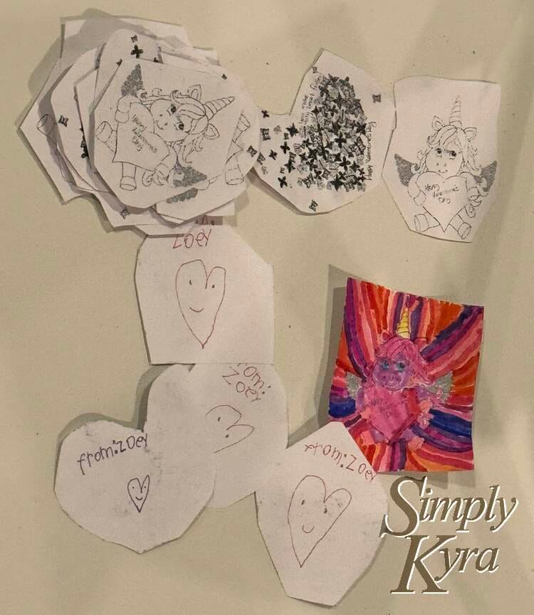 The cards are all laid out with the front of most plain and one really colorful. The backs that are shown say Zoey with a smiley heart.