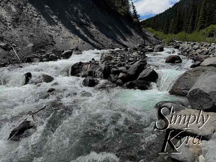 Raging river crashing through rocks.